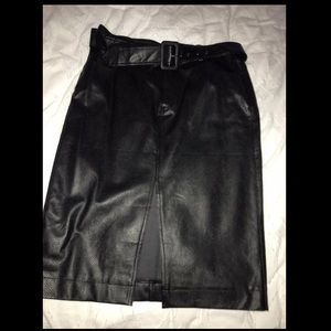 NEW never worn. Pleather skirt with Belt. All Sales are Final